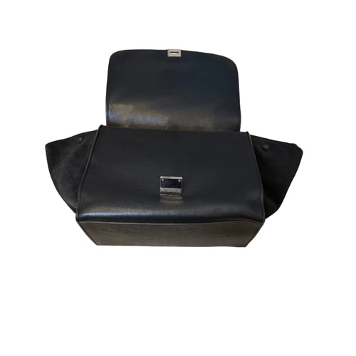 Black leather motorcycle seat with visible stitching on a white background