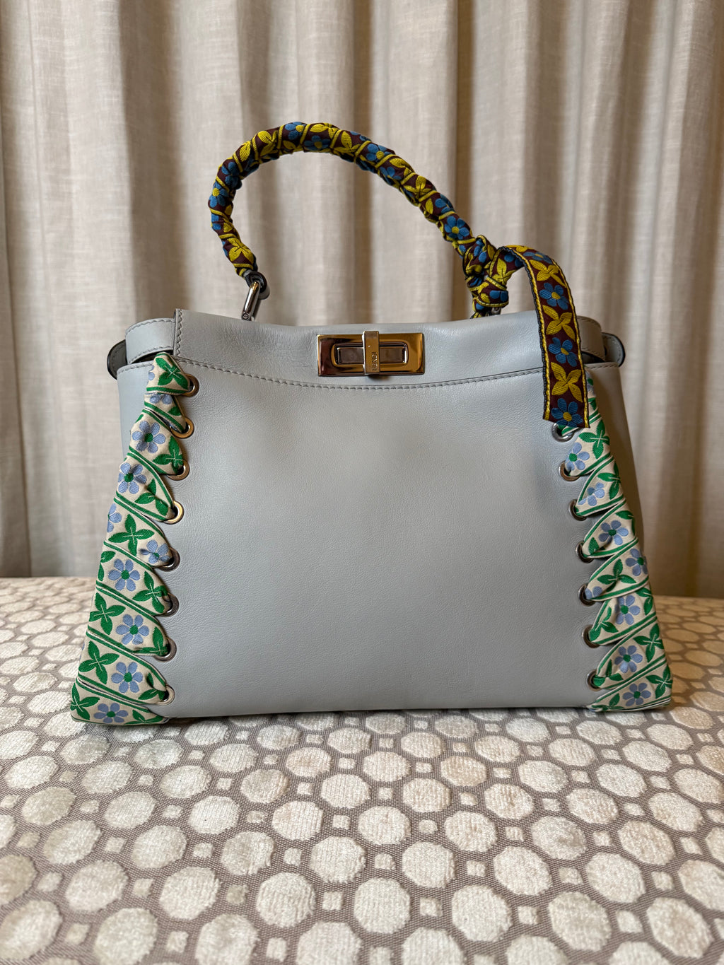Fendi Peekaboo Regular satchel in gray leather featuring ribbon whipstitch detailing. 