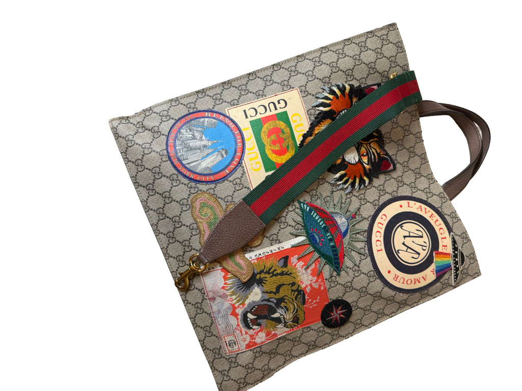 Gucci Gg Supreme Courrier Tote Bag Featuring A Variety Of Embroidered Appliques On The Gg Monogram Coated Canvas