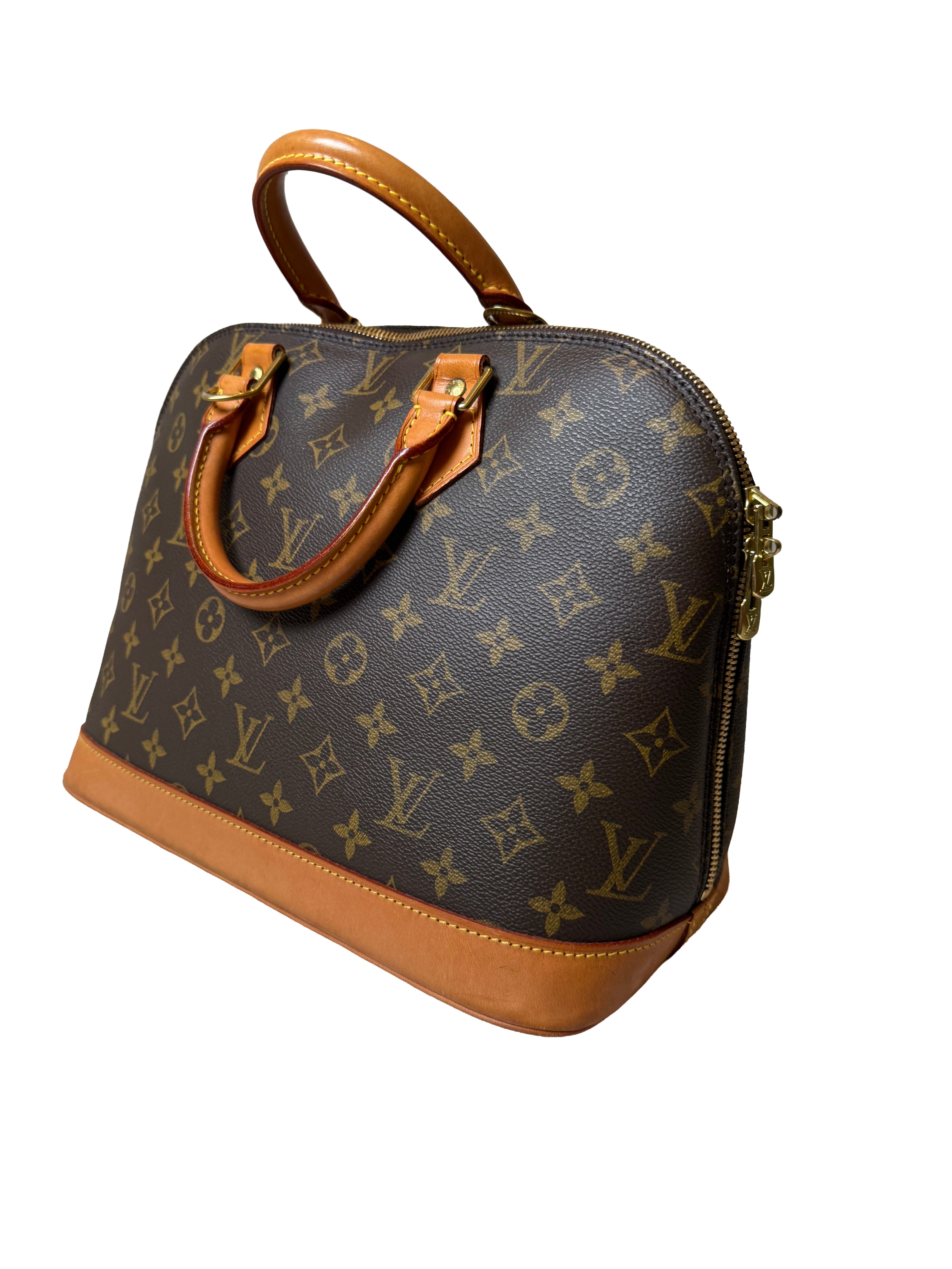 Louis Vuitton Alma Pm Handbag In The Iconic Monogram Canvas