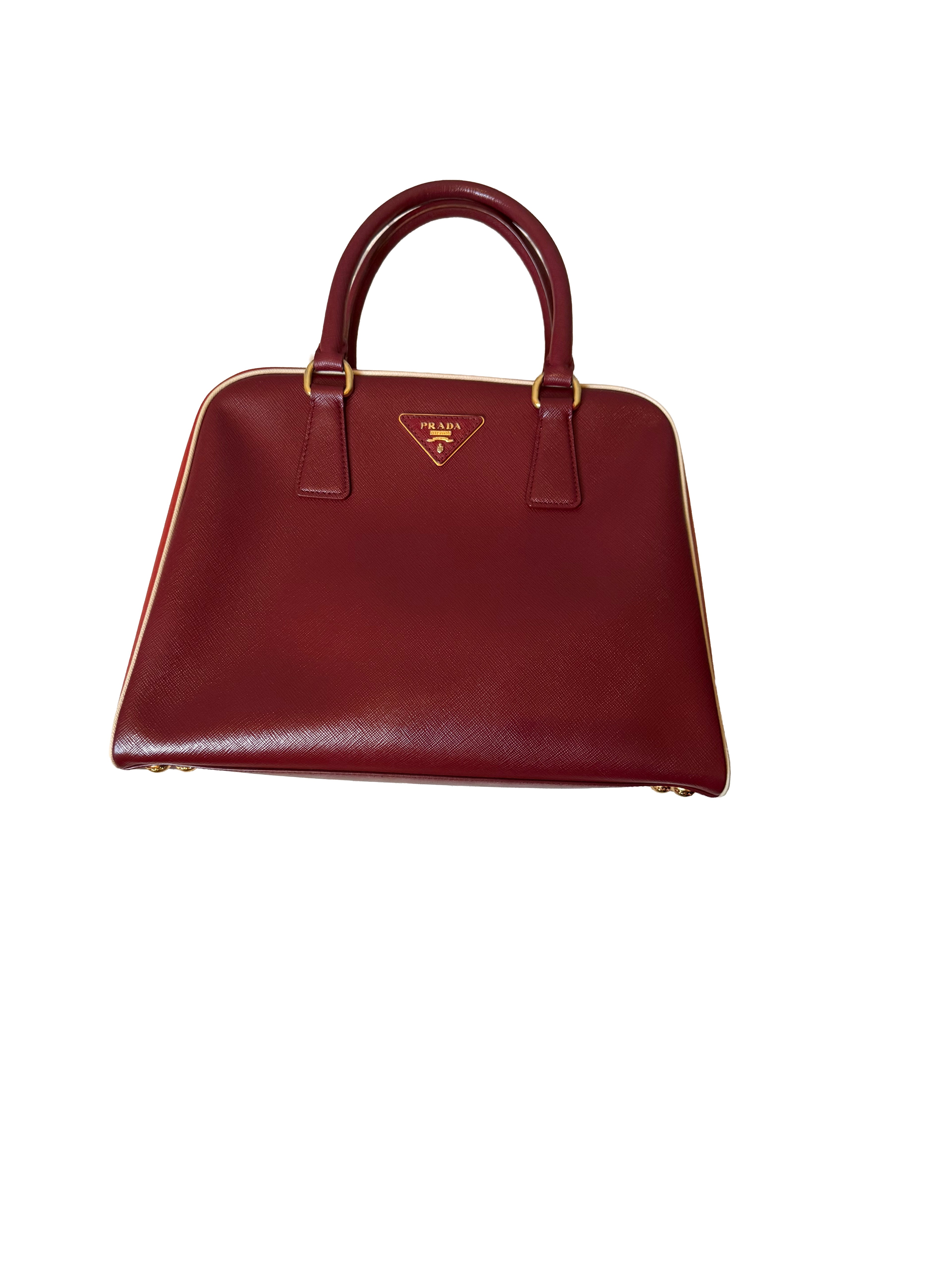 Prada Saffiano Lux Pyramid Bag In A Red Colorway Featuring A Tricolor Design Gold Tone Hardware And Rolled Leather Handles