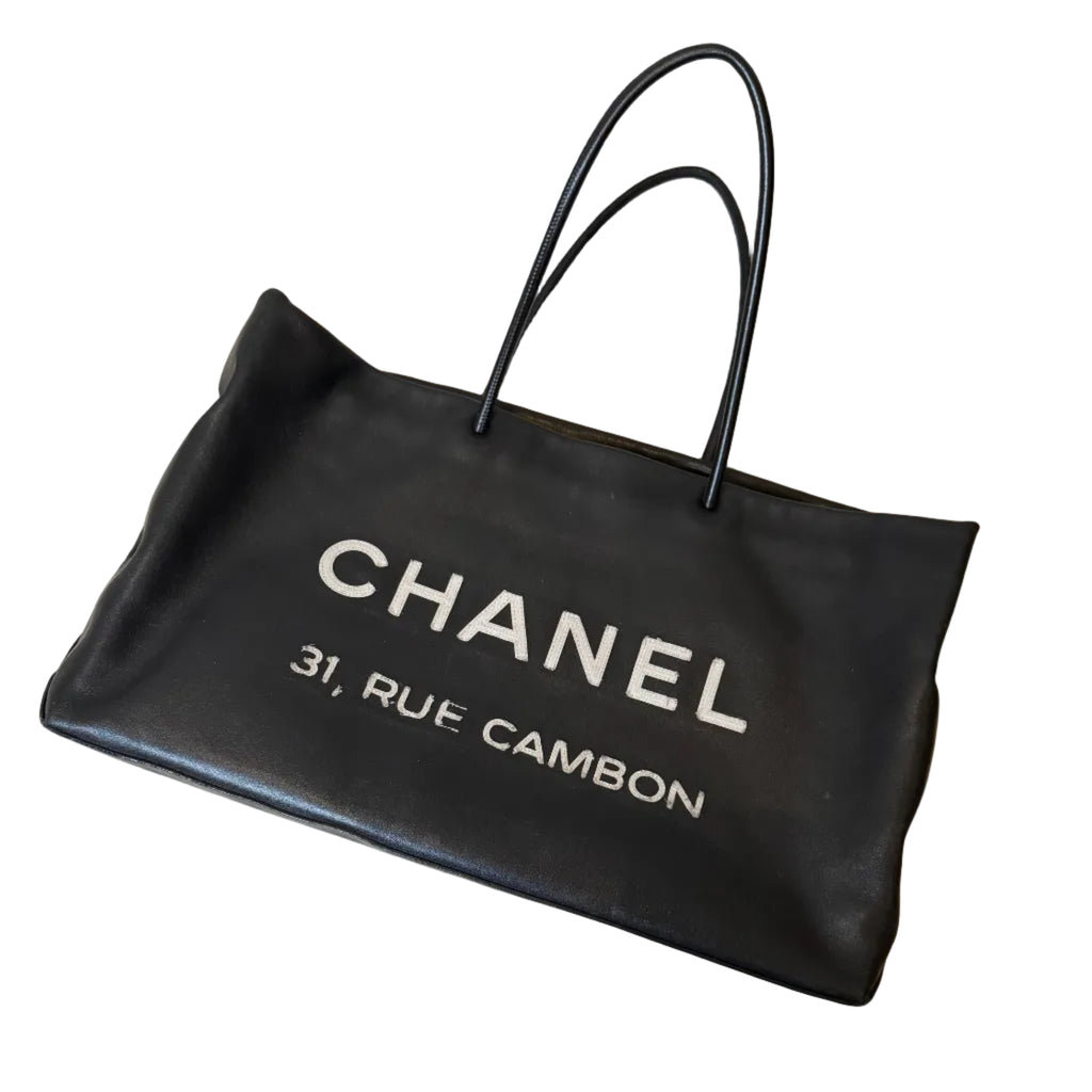 Black Chanel bag on a patterned surface