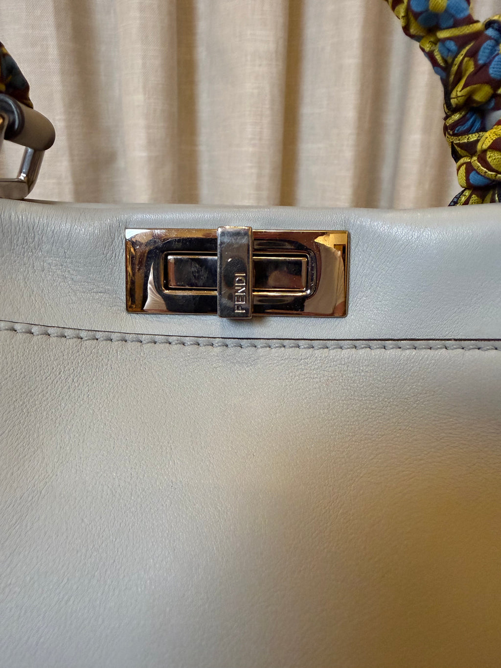 Fendi Peekaboo Regular satchel in gray leather featuring ribbon whipstitch detailing. 